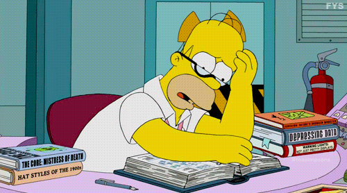 A GIF of Homer Simpson looking stressed while turning pages in a book.